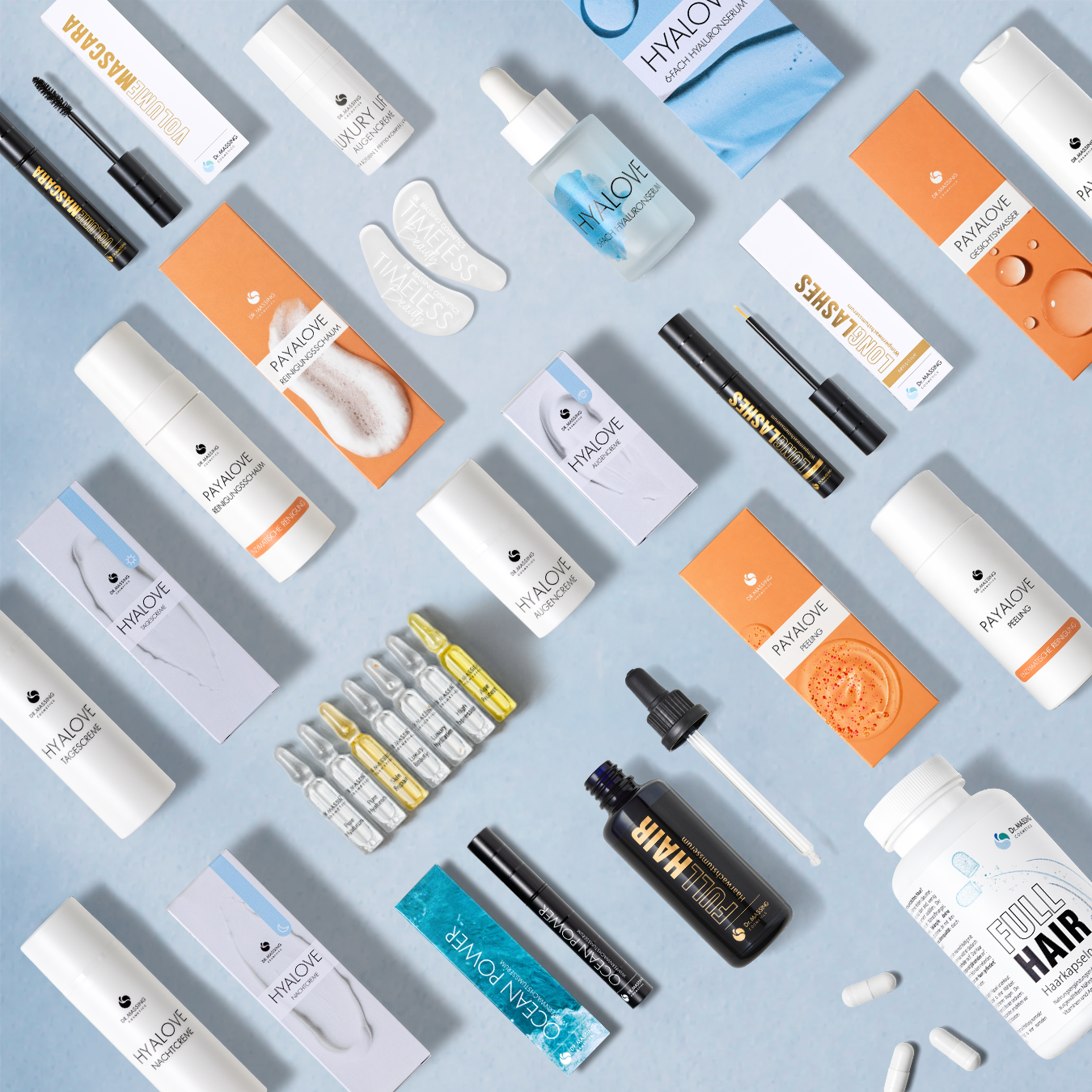 Flatlay von allen Dr. Massing Produkten auf hellem Hintergrund